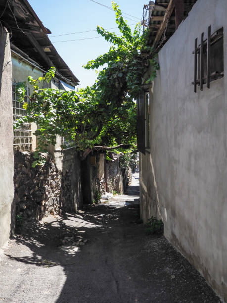 istock old narrow stone street between houses in Yerevan 1663184255