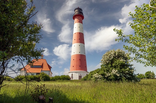 Lighthouse Westerhever with stunning cloud formation at the Baltic Sea, Germany