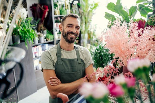 istock Portrait of a florist working in the flower shop 1663208421