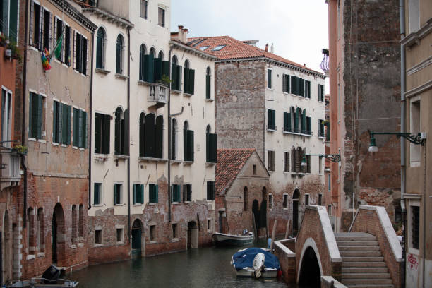 istock Canal in venice, bridge, boats and typical old houses 1663209291