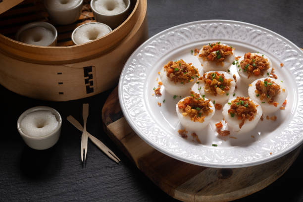 istock Asian food concept spot focus Chwee Kueh Strem savory rice cake on black background with copy space 1663227951