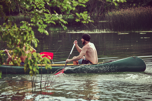 Males Trying Out Summer Sports Such As Canoeing