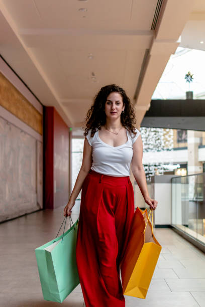 istock Young woman discovers the latest trends while shopping at the mall 1663245317