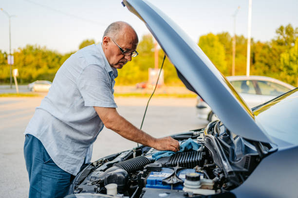 istock Senior Man Wiping His Car Interior With A Rag 1663255137