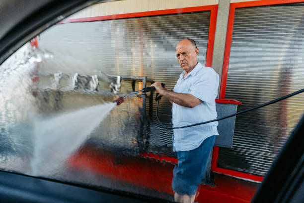 istock Senior Man Washing His Car In A Self Service Car Wash 1663256537