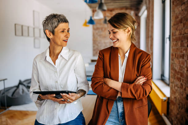 istock Female business partners talking at modern office 1663266914
