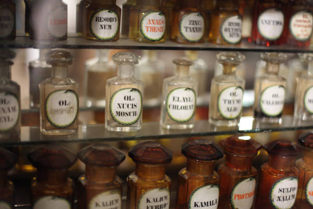 istock Shelves with medicines glass bottles in the old pharmacy. Soft focus blur background. 1663274913