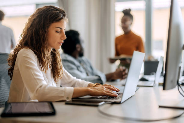 istock Young well dressed businesswoman working at modern office 1663280319