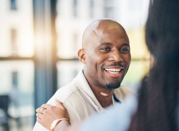 istock Support, businessman and woman with hand on shoulder in care, kindness and empathy at work together. Teamwork, gratitude and smile, motivation for happy black man and manager in office collaboration. 1663281908