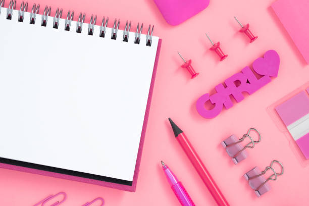 istock Empty notebook page for text with pink stationery. Eraser in form of word girl. 1663283495