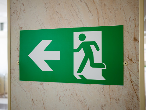 Safe Exit Abstract A Green Emergency Exit Sign Indicating A Safe Exit To A Safe Area Fire ...