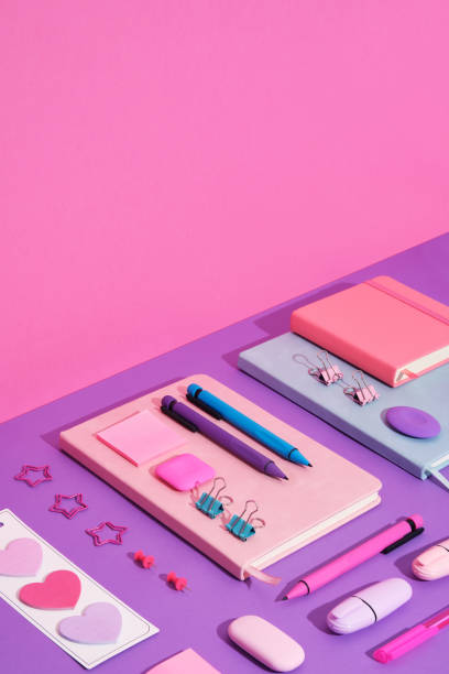 istock Stationary background with magenta, cyan and violet pens, clips and erasers 1663283538