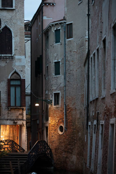 istock Canal in venice, bridge, boats and typical old houses 1663287402