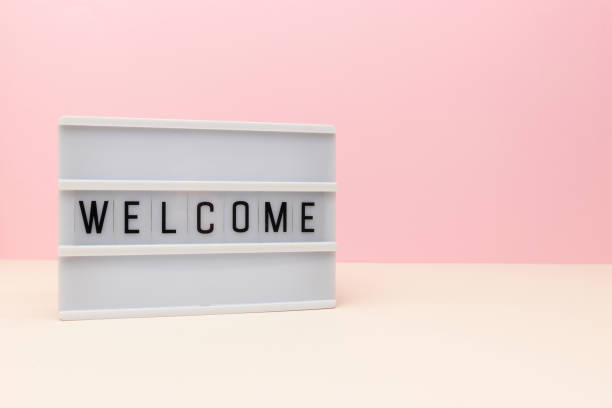 istock Word Welcome. Lightbox with letters in front of pink background. 1663294424