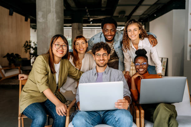 istock Group of young business people posing for a shot at office cafeteria 1663303140
