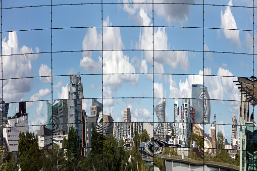 Rotterdam, Netherlands  September 1, 2022 : The depot building of museum Boijmans van Beuningen for the storage and exposure of 150.000 pieces of art. The skyline of Rotterdam is reflected in the mirrors attached to the building.