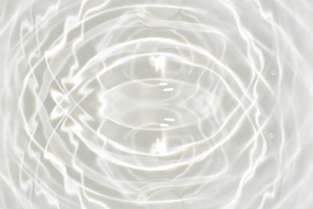 istock White water with ripples on the surface. Defocus blurred transparent white colored clear calm water surface texture with splashes and bubbles. Water waves with shining pattern texture background. 1663309034