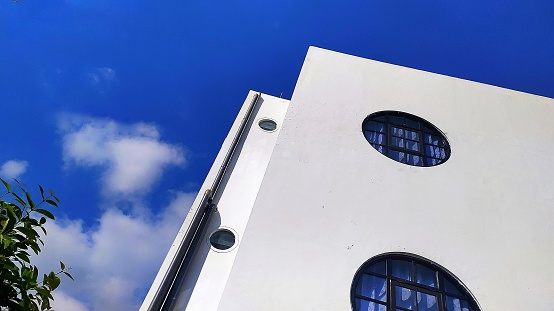 Corner of modern building with blue sky