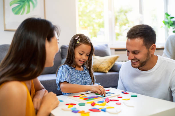 istock Multiracial family playing with puzzles, in their home 1663330197