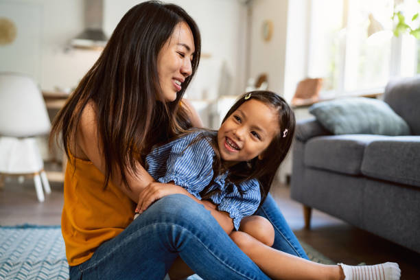 istock Mother Japanese ethnicity embracing her daughter 1663332903