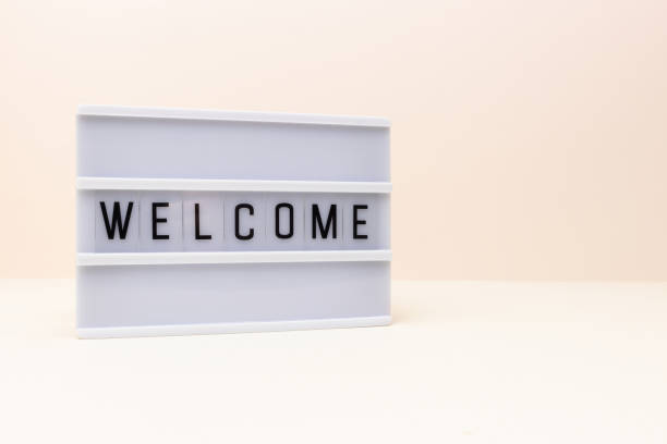 istock Word Welcome. Lightbox with letters in front of beige background. 1663338907