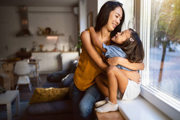 istock Mother and daughter Japanese ethnicity hugging 1663342342