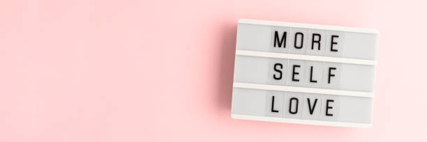 istock More self love. White lightbox with letters on a pink background. 1663356401