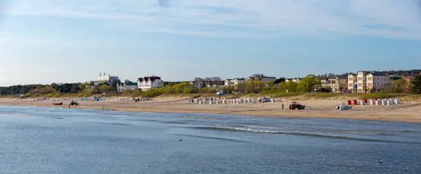 scenic view to beach, roofed wicker beach chairs and hotels at Ahlbeck beach, Usedom, Germany.