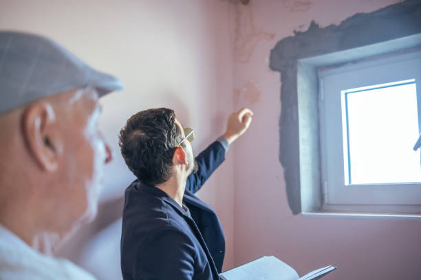 istock Claims adjuster observing the damage in the ceiling 1663369531