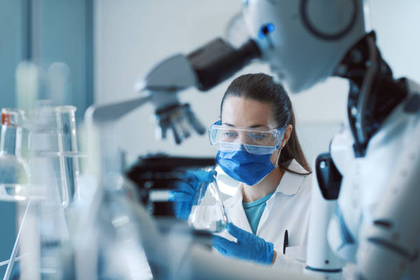 istock Scientist and humanoid robot working together in the science lab 1663376026