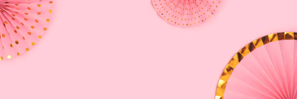 istock Banner with paper fans on a pink background. 1663378159