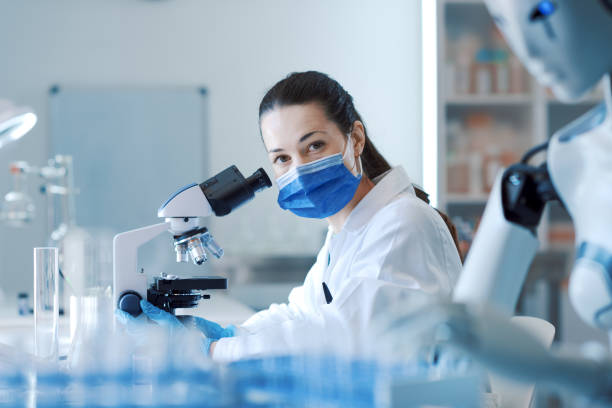 istock Scientist and humanoid AI robot in the science lab 1663384278