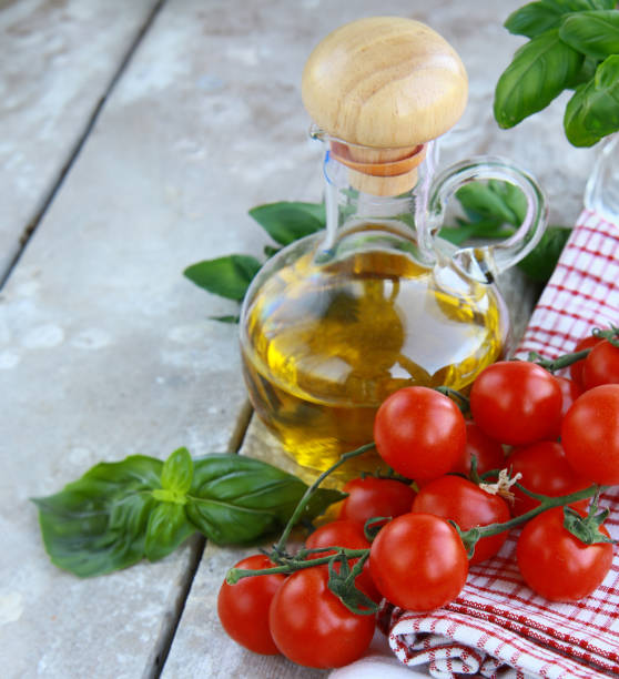 istock fresh organic tomatoes and basil on wooden background 1663385911