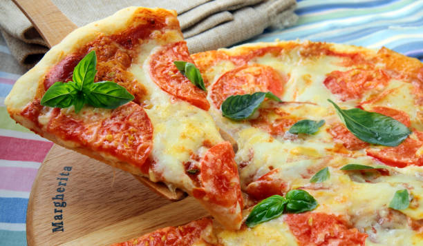 istock homemade traditional pizza with mozzarella cheese and tomatoes 1663390872