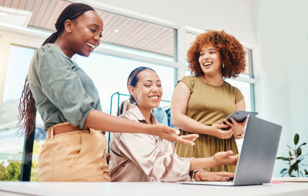 istock Employees, teamwork and review on tech in office with creative, ideas for fashion or ecommerce on computer or tablet. Online, stylist and happy women in Colombia startup talking about clothing 1663394013