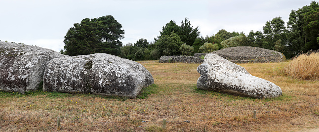 Broken Menhir of Er Grah - the largest menhir erected in the Neolithic era and tumulus Table des Marchand, Locmariaquer, Brittany, France