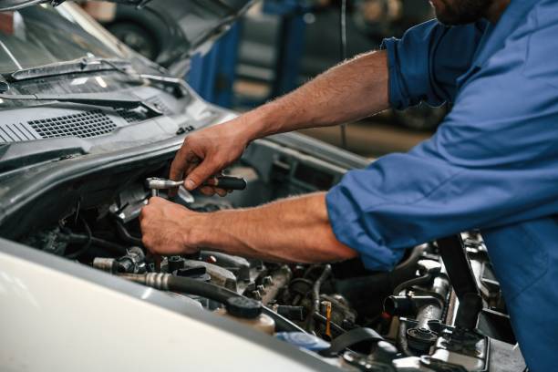 istock Repair service. Auto mechanic working in garage 1663395328