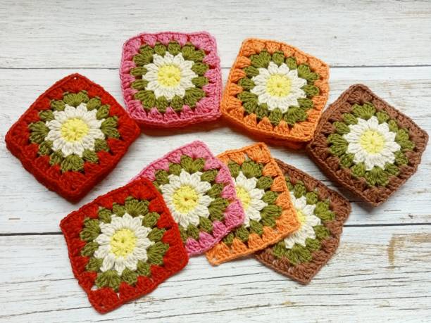 istock Crochet granny square daisy flower 1663400184