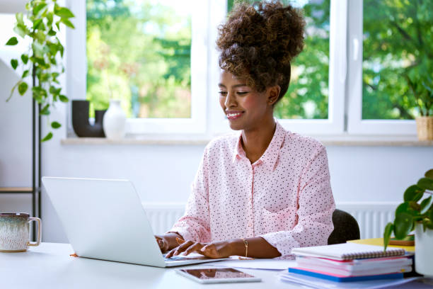 istock Beautiful woman working at home on laptop 1663409033