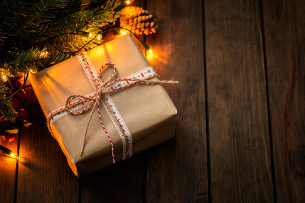istock Christmas present wrapped with kraft paper 1663420451