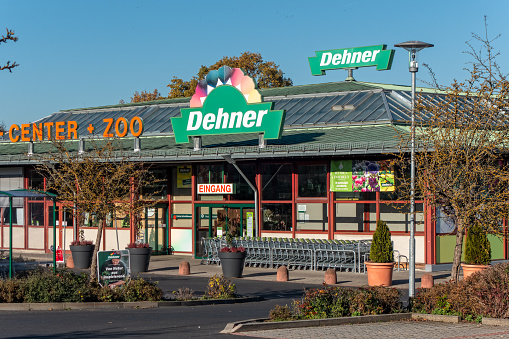 Amberg, Germany - November 13, 2022: Store of the garden and pet supplies chain Dehner in the german town Amberg. Wholesale and retail. Headquarter in the town Rain am Lech , Swabia, Bavaria. Sunny day with blue sky.