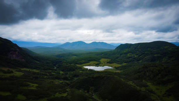 istock Kamchatka reliefs, volcanoes, clouds in the mountains 1663441818