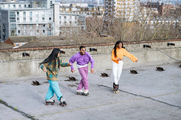 istock Diverse group of roller skaters on urban rooftop 1663445932