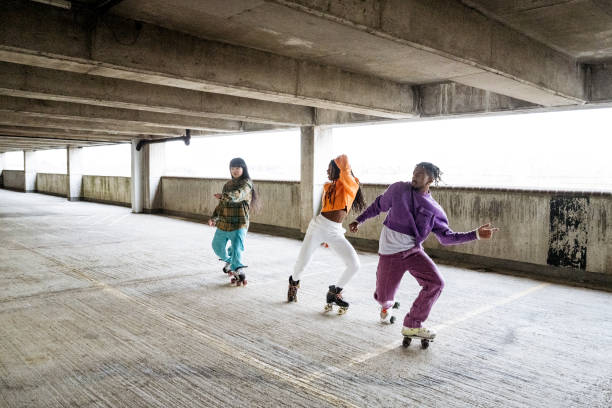 istock Friends freestyle roller skating in urban garage 1663446271