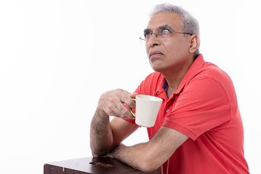 Portrait of senior man drinking coffee