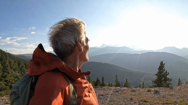 istock Mature male hiker arrives on mountain summit 1663457049