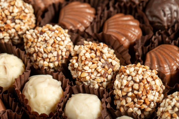 istock Truffle chocolate. Various chocolate pralines in bulk. close up 1663495216