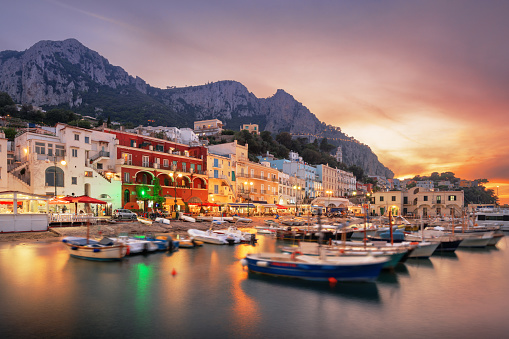 Capri, Italy with shops and restaurants at at Marina Grande at twilight.