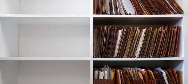 istock Files Organized on Office Shelf For Clients Papers and Information 1663551110