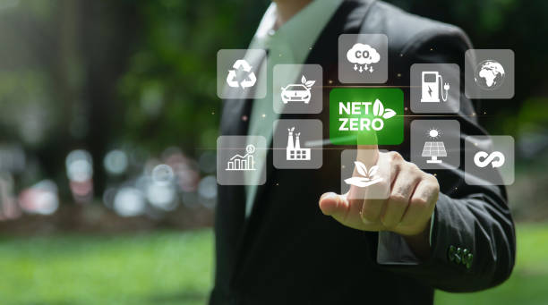 istock Businessman touching on words Net zero with Net zero icons on nature backgroud. Net zero and carbon neutral concept. Net zero greenhouse gas emissions target.Climate neutral long term strategy. 1663552313